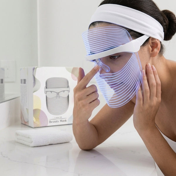 How to use byTheia 7 Colour LED face mask step 3 - place wireless mask on face with nose pads for secure hands-free fit