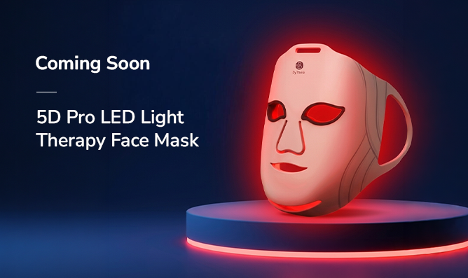 byTheia LED face mask glowing in red light mode - clinically studied wavelengths 415nm blue 633nm red and 850nm near-infrared for photobiomodulation therapy Canada